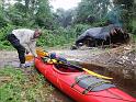 P24 campsite near river and securing the kayak for the night.